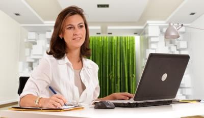 woman working at desk with computer