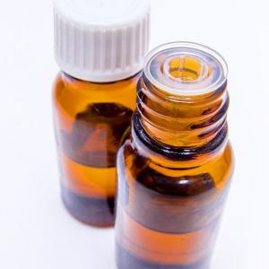 Brown glass essential oil bottles with white lids